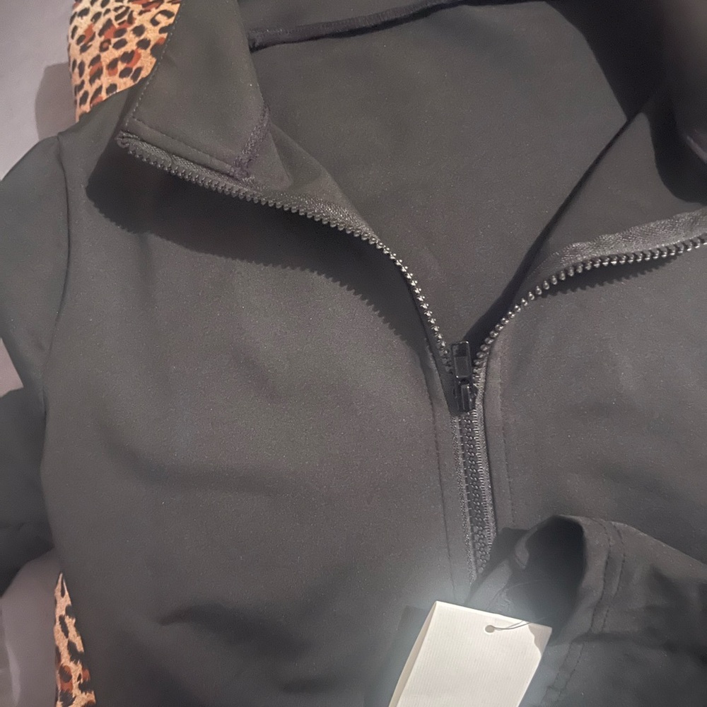 Zip up compression jacket black. New never used.